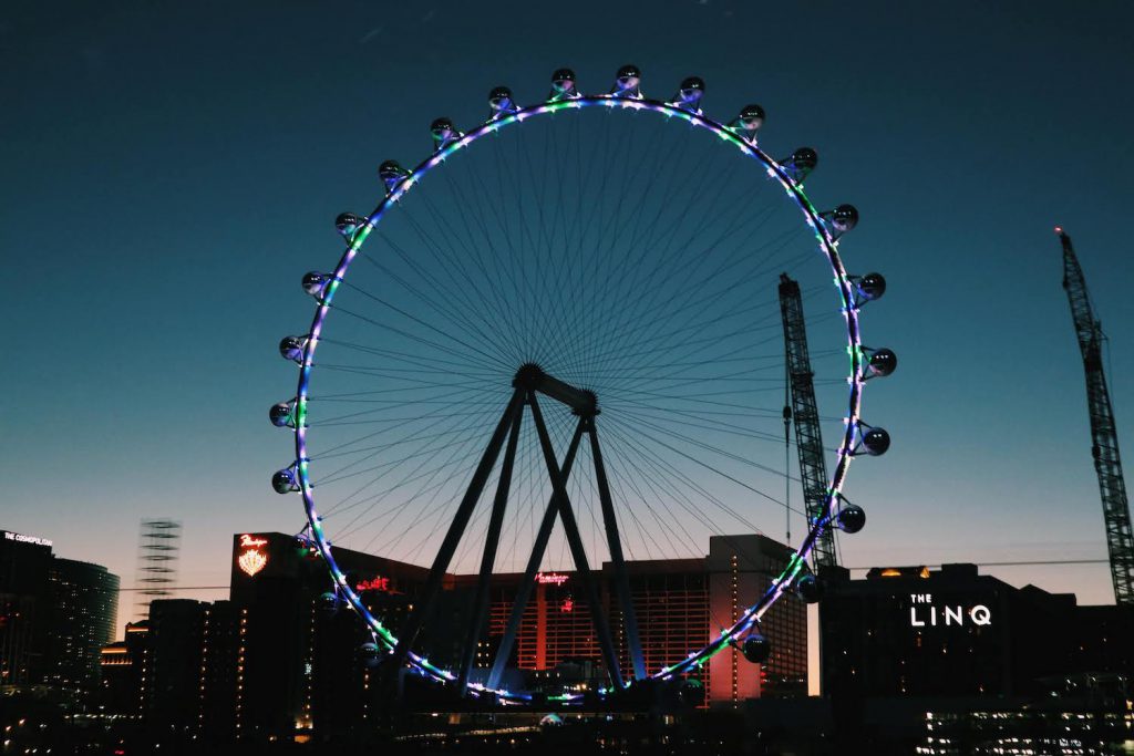 the 550-foot tall high roller wheel at the linq in las vegas lit up at sunset