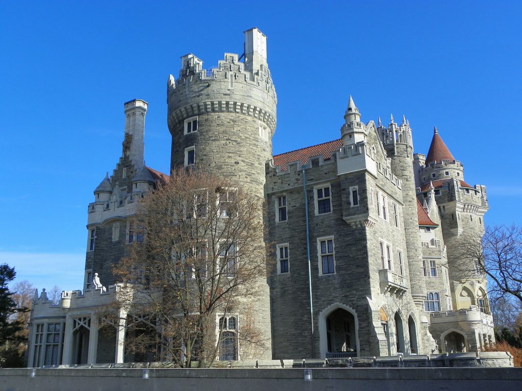 exterior of casa loma castle under a blue sky in toronto
