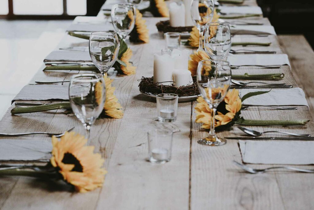 Delicate branches are woven together to make an elegant wreath for a fall wedding centerpiece