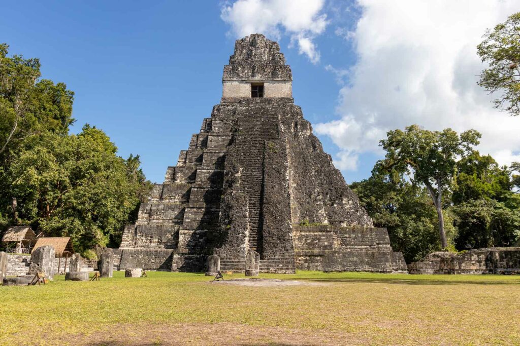 The ancient ruin of Tikal surrounded by trees in Guatemala