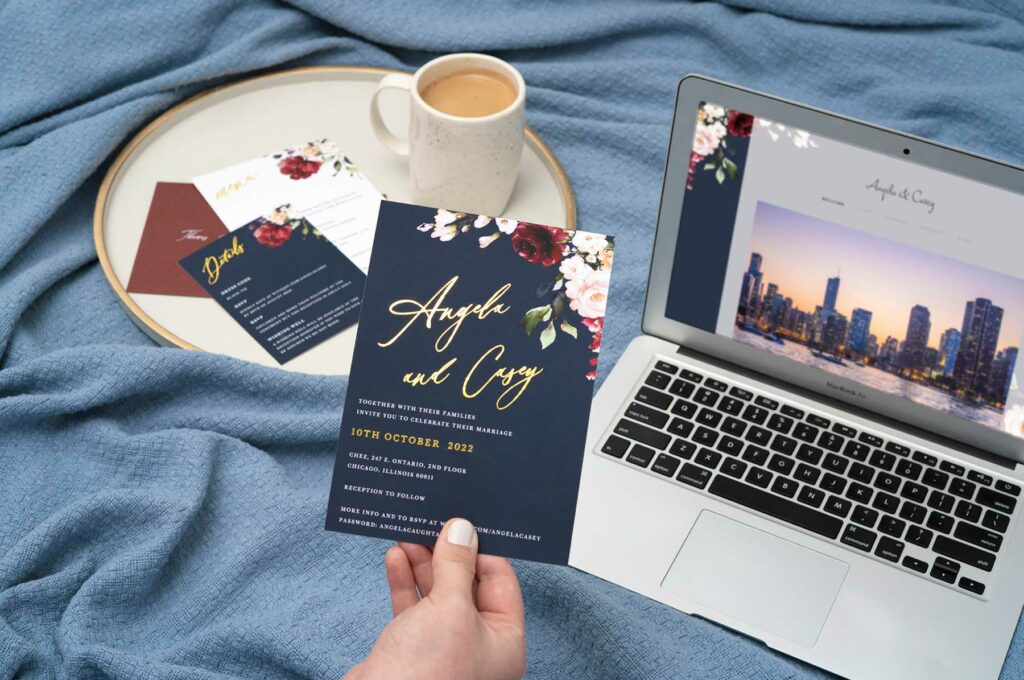 Wedding invitation guide photo featuring Joy's La Butte theme with a hand holding the invitation and a wedding website and insert cards in the background