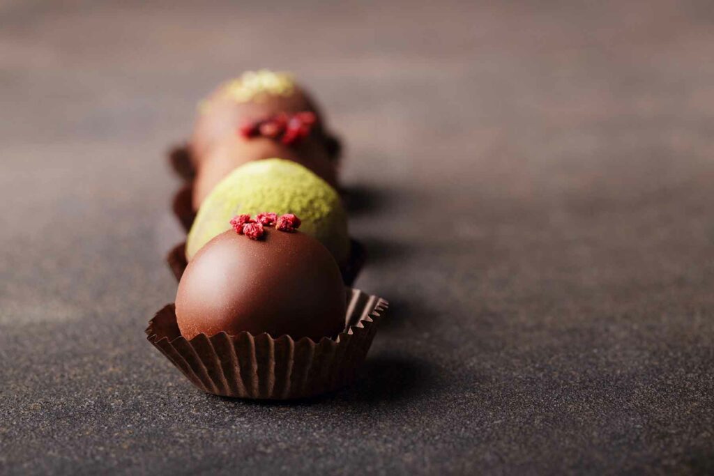 Wedding favor gift idea: Four elegant chocolate truffles in a row