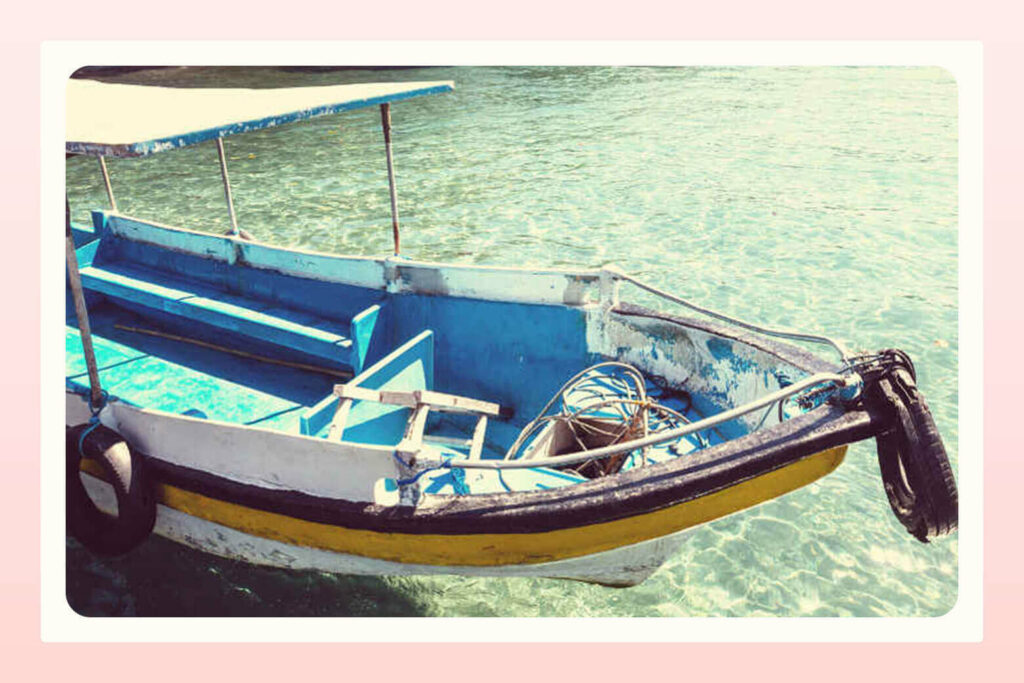 view of motorboat in the ocean as a travel experience for newlyweds