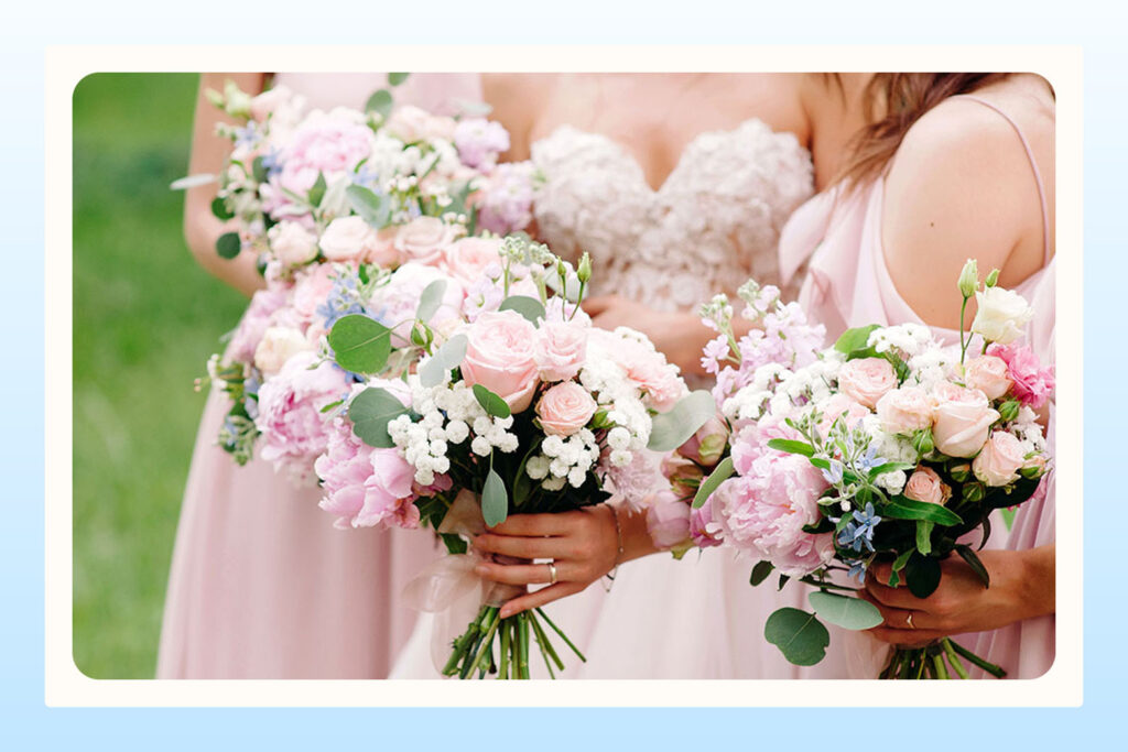bride with bridesmaids wearing soft pink dresses